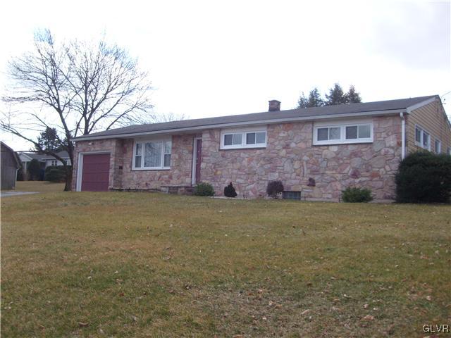 2276 Jordan Road Orefield, PA 18069 - Photo 1 of 17 a front view of a house with a garden
