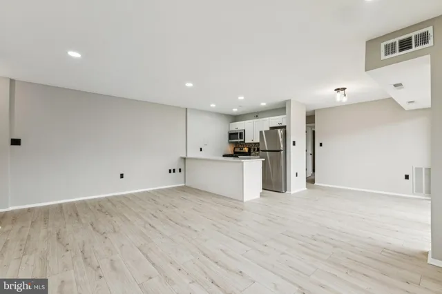a view of kitchen with wooden floor