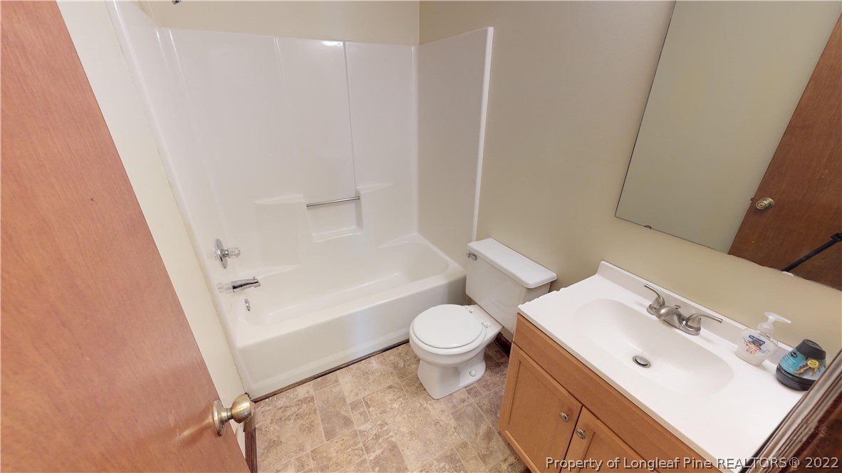 508 Jennings Farm Road Fayetteville, NC 28314 - Photo 15 of 24 a white toilet sitting next to a bathroom sink