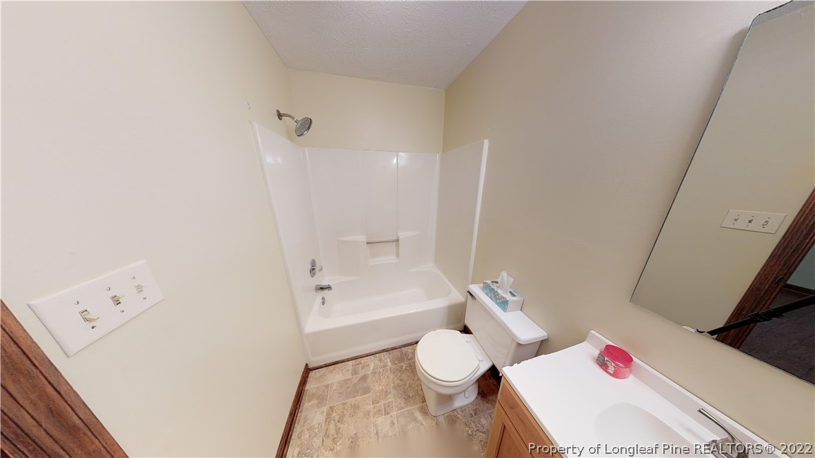 508 Jennings Farm Road Fayetteville, NC 28314 - Photo 16 of 24 a white bath tub sitting next to a white toilet