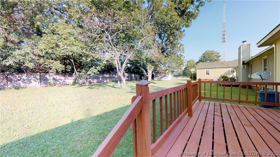 508 Jennings Farm Road Fayetteville, NC 28314 - Photo 18 of 24 a view of a balcony with wooden floor and trees