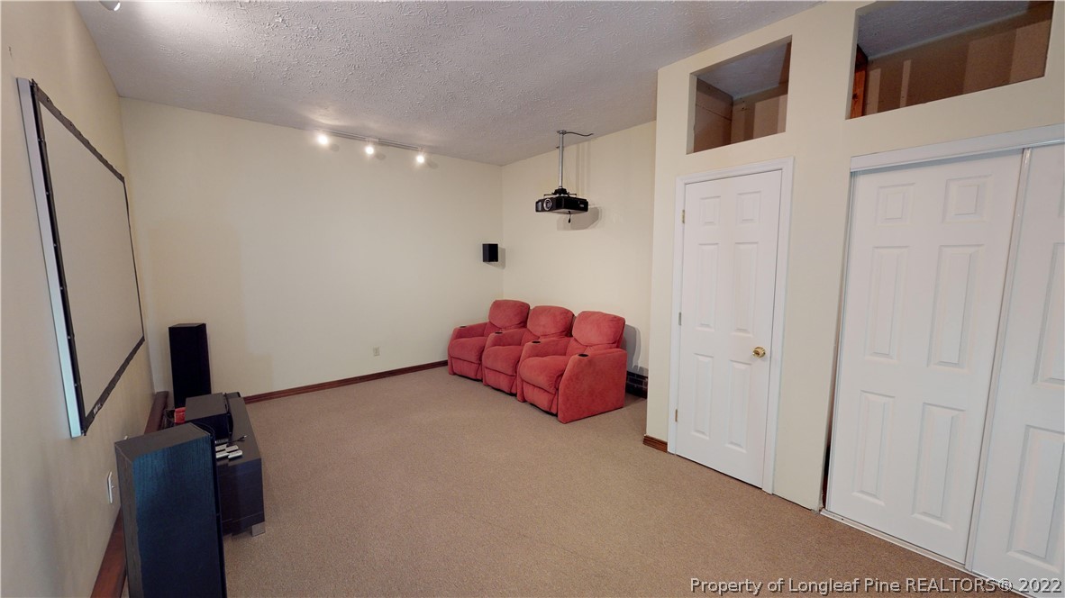508 Jennings Farm Road Fayetteville, NC 28314 - Photo 22 of 24 a hallway with stairs and a wooden floor