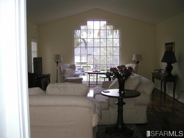 149 Warren Road San Mateo, CA 94401 - Photo 3 of 10 a living room with furniture and a window