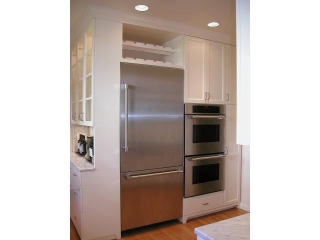 149 Warren Road San Mateo, CA 94401 - Photo 7 of 10 a metallic refrigerator freezer sitting in a kitchen