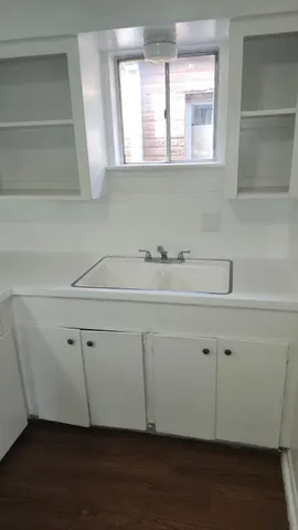 a bathroom with a sink and a window