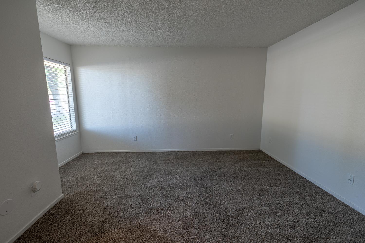 3700 Tully Road, Unit 5 Modesto, CA 95356 - Photo 21 of 38 an empty room with a window