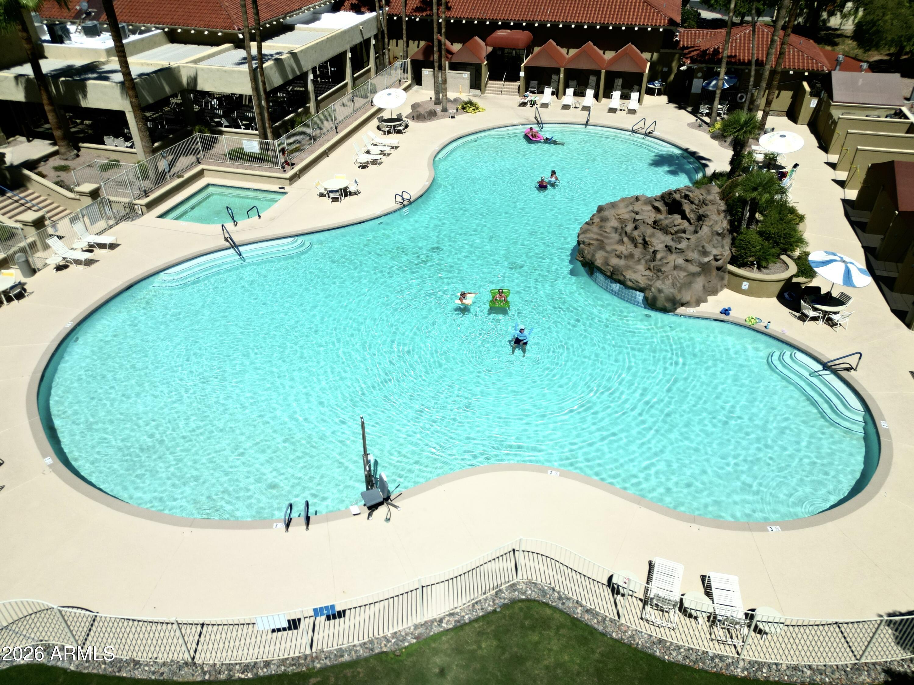 14300 West Bell Road, Unit 49 Surprise, AZ 85374 - Photo 16 of 19 46Huge_Community_Pool_with_Water_Feature
