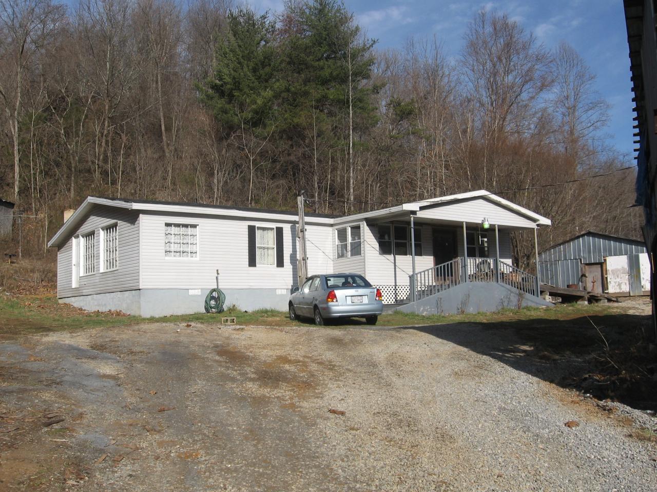 379 Friendship Road Shawsville, VA 24162 - Photo 1 of 1 a front view of a house with garden