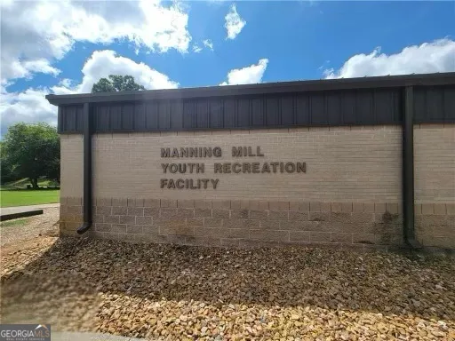 a swimming pool view with a outdoor seating