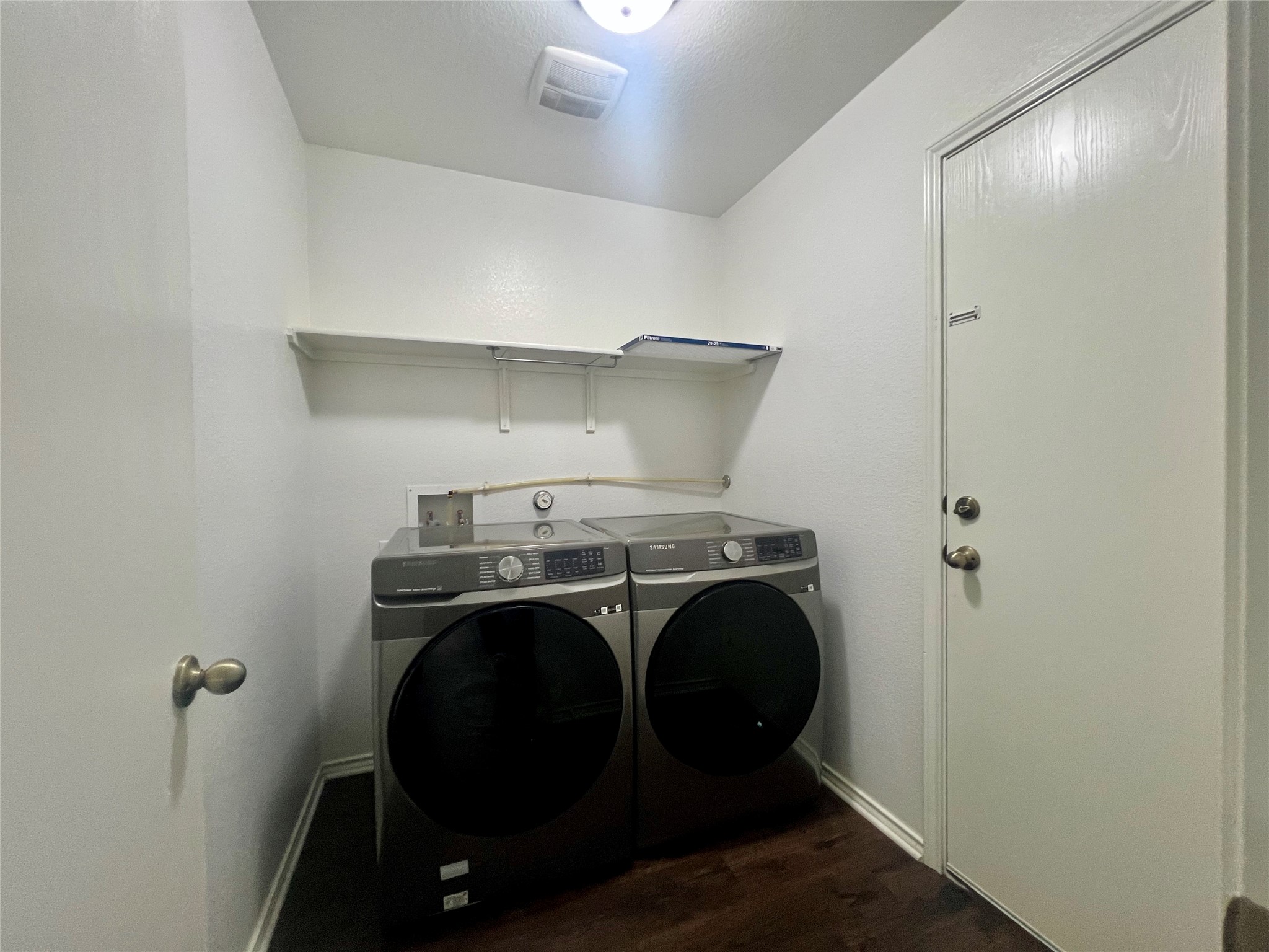 270 Sheep Trail Drive Kyle, TX 78640 - Photo 16 of 27 a utility room with dryer and washer