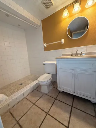 a bathroom with a sink a toilet and a bathtub