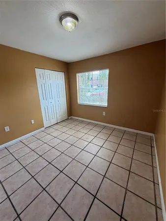 a view of an empty room and window