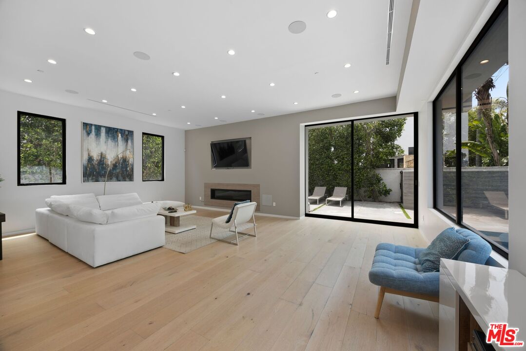 839 North Spaulding Avenue Los Angeles, CA 90046 - Photo 12 of 46 a living room with furniture and a large window