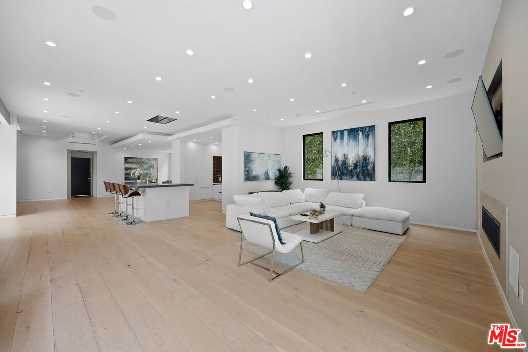 839 North Spaulding Avenue Los Angeles, CA 90046 - Photo 14 of 46 a living room with furniture and a flat screen tv