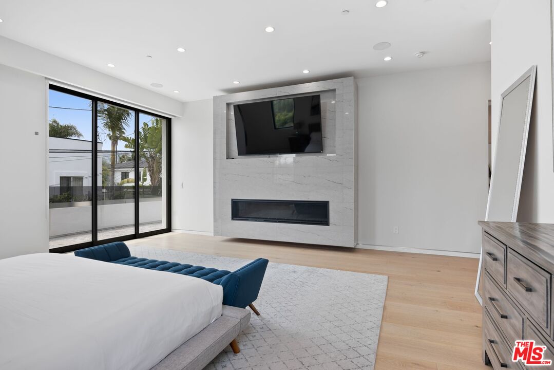 839 North Spaulding Avenue Los Angeles, CA 90046 - Photo 28 of 46 a living room with furniture and a fireplace