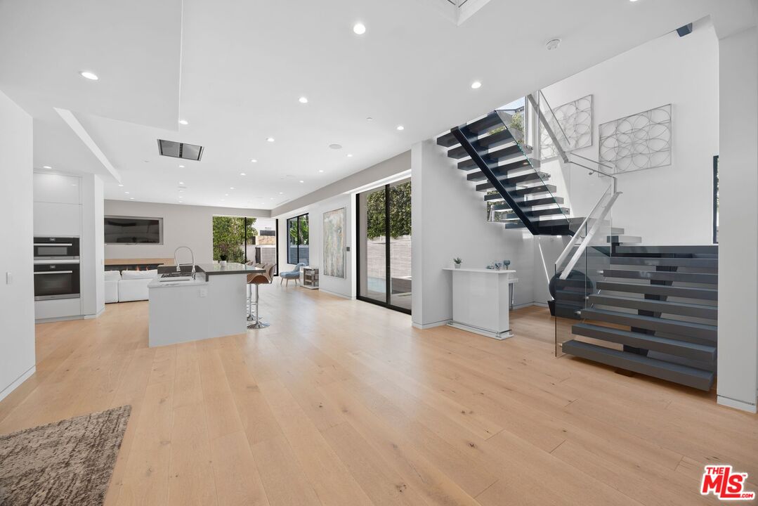 839 North Spaulding Avenue Los Angeles, CA 90046 - Photo 6 of 46 a view of kitchen with furniture and a ceiling fan