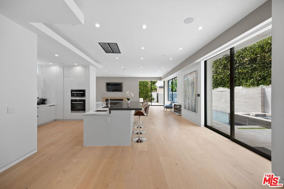 839 North Spaulding Avenue Los Angeles, CA 90046 - Photo 7 of 46 a view of a living room and a floor to ceiling window
