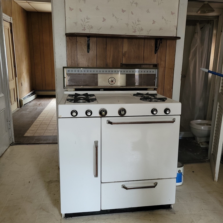 467 East 3rd Street Boston, MA 02127 - Photo 18 of 18 a white stove top oven sitting inside of a kitchen