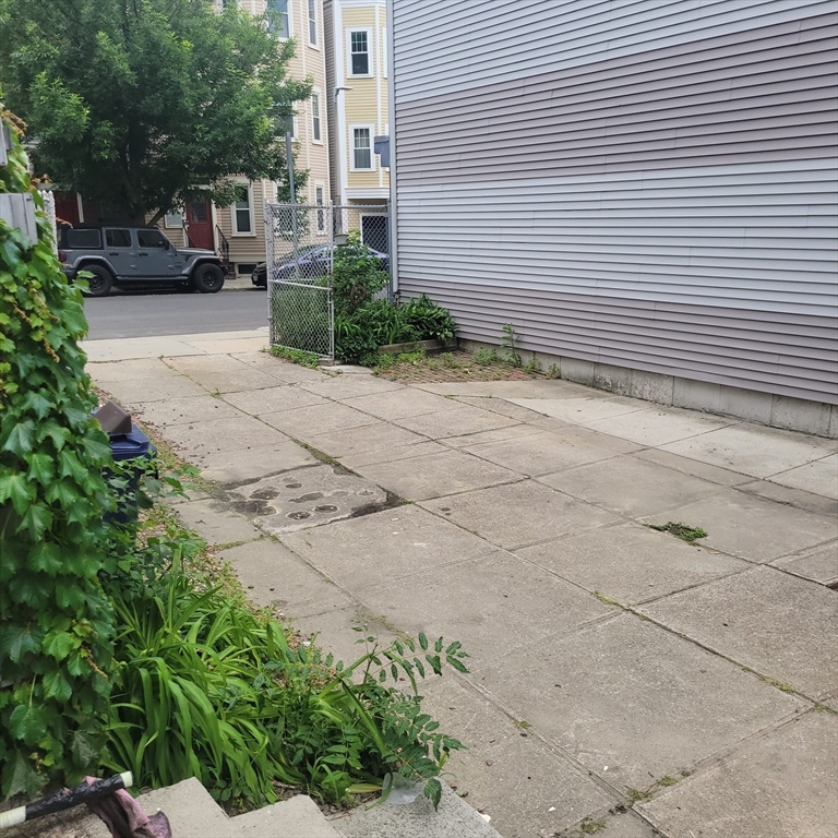 467 East 3rd Street Boston, MA 02127 - Photo 4 of 18 a front view of a house with a yard