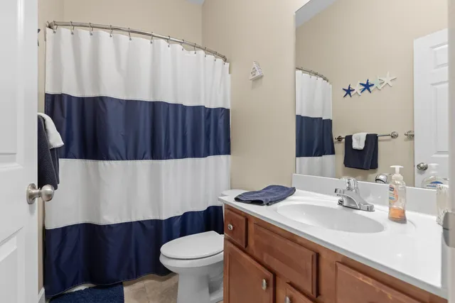 a spacious bathroom with a shower sink double and mirror