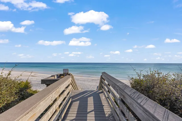 a kitchen with stainless steel appliances granite countertop a refrigerator a stove top oven a sink and dishwasher