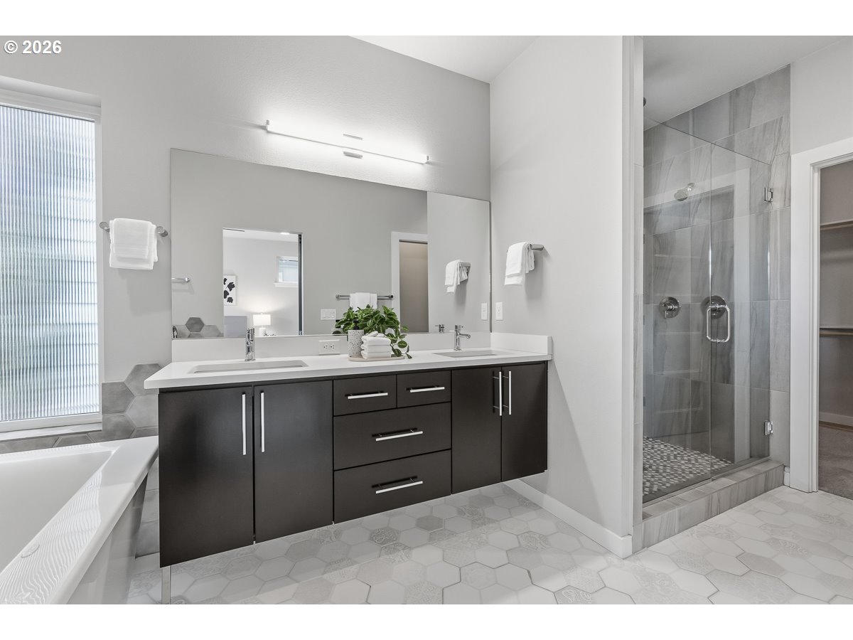 11375 Southwest Barber Street Wilsonville, OR 97070 - Photo 15 of 26 a bathroom with a tub sink and mirror