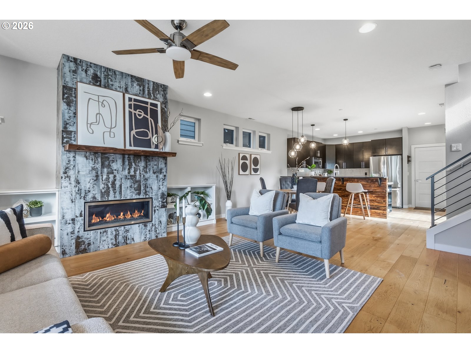 11375 Southwest Barber Street Wilsonville, OR 97070 - Photo 5 of 26 a living room with furniture and a fireplace