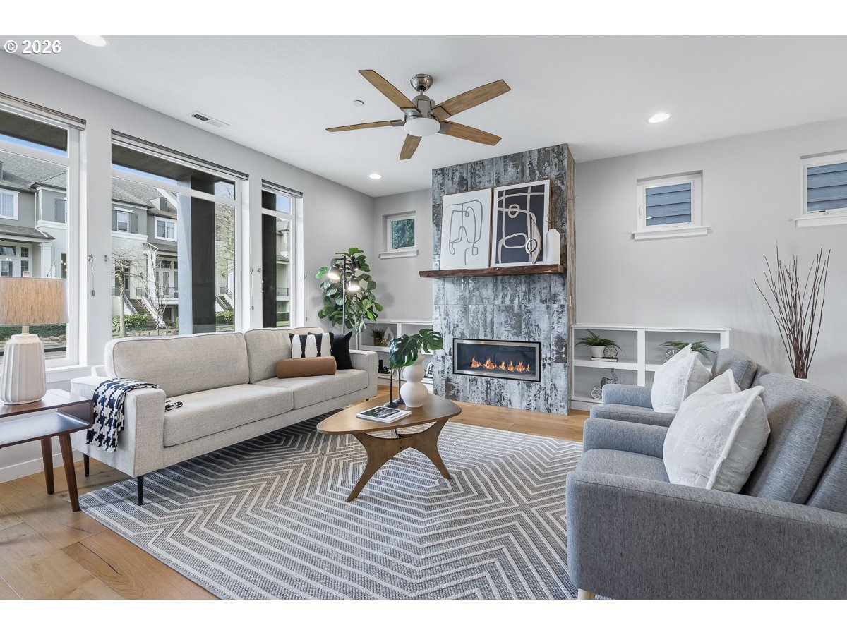 11375 Southwest Barber Street Wilsonville, OR 97070 - Photo 6 of 26 a living room with furniture and a fireplace