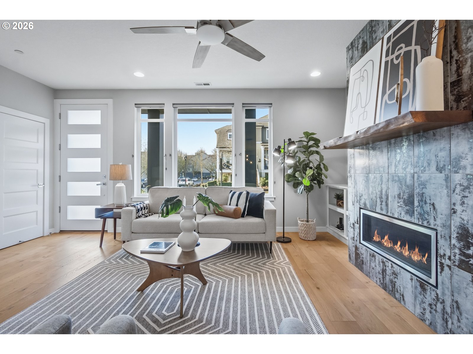11375 Southwest Barber Street Wilsonville, OR 97070 - Photo 8 of 26 a living room with furniture and a fireplace