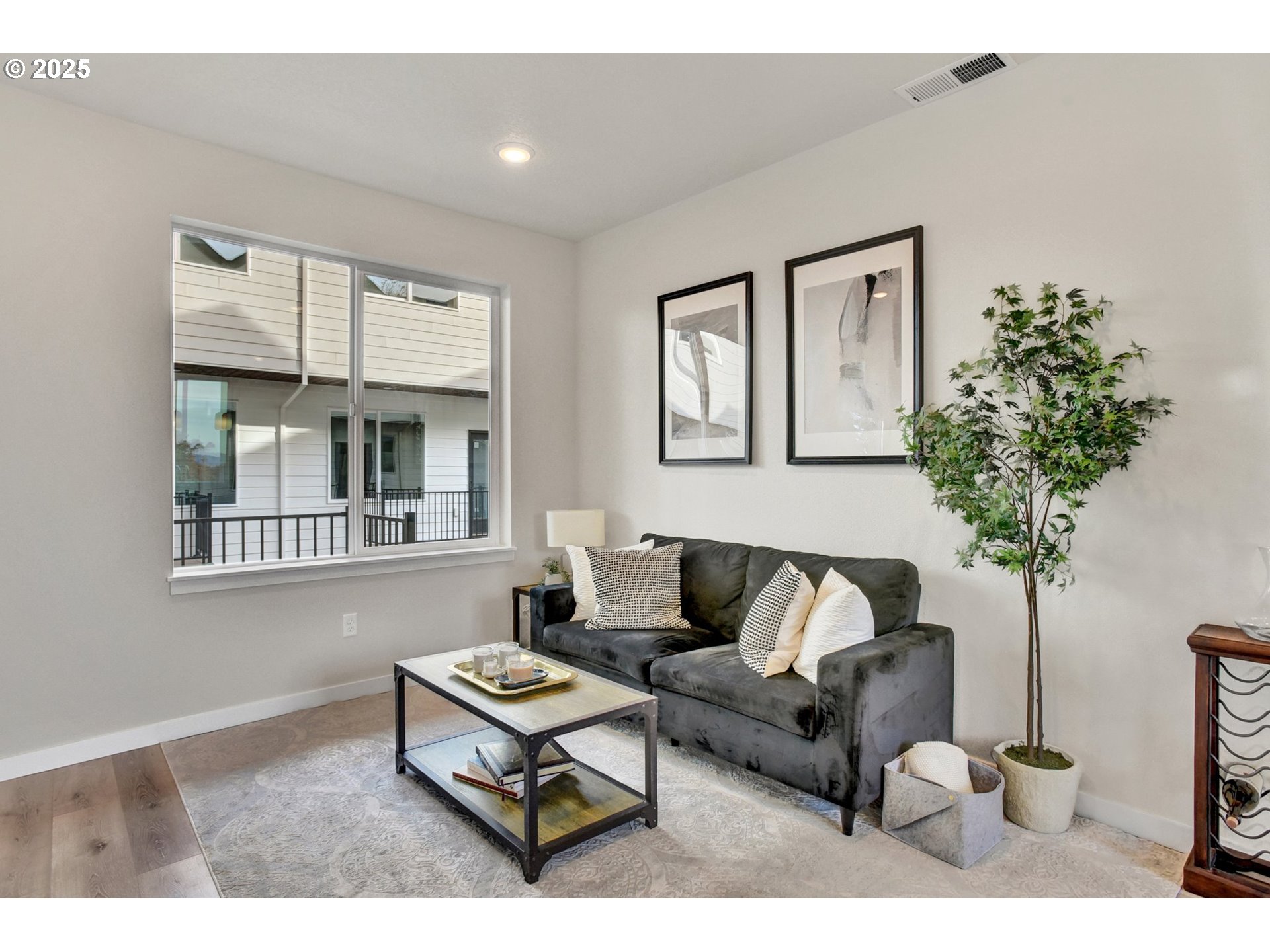 1669 Southeast Sherrett Street Portland, OR 97202 - Photo 3 of 14 a living room with furniture a potted plant and a window