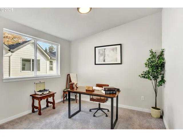 a workspace with furniture and a potted plant