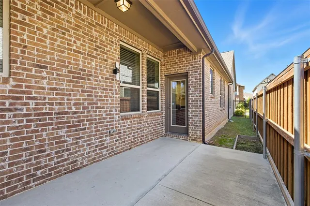 a view of a porch with wooden stairs