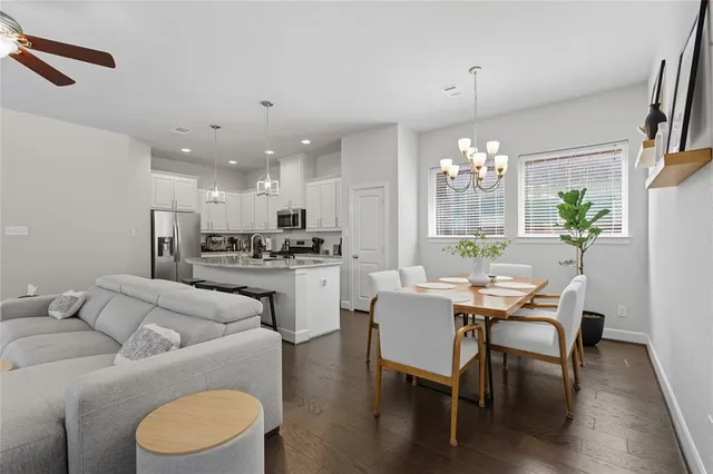 a view of a dining room with furniture and wooden floor