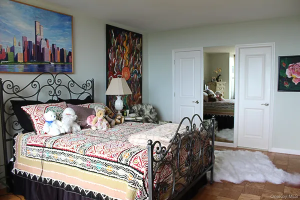 a bedroom with a bed and walk in closet