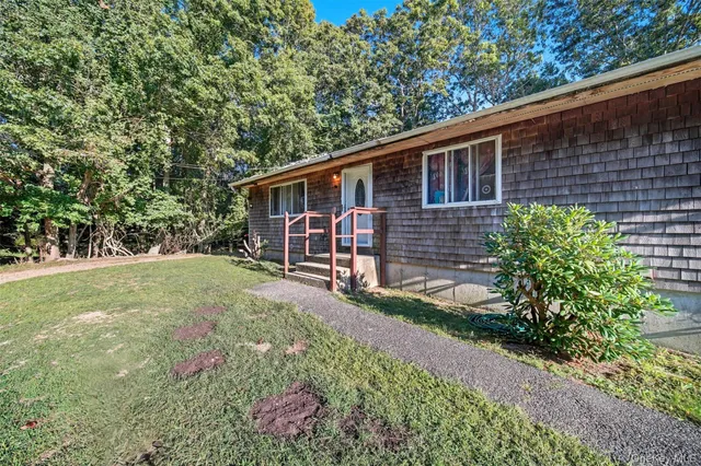 a backyard of a house with lots of green space