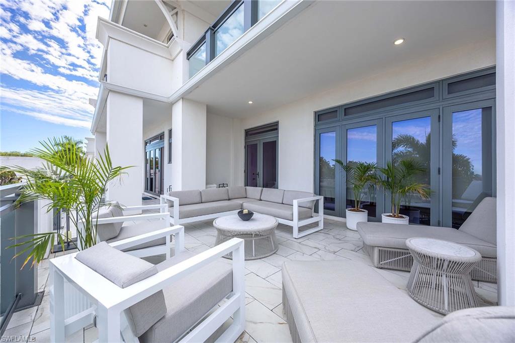 875 6th Avenue South, Unit 203 Naples, FL 34102 - Photo 12 of 49 Entertain in style with the luxurious 800 sqft lanai.