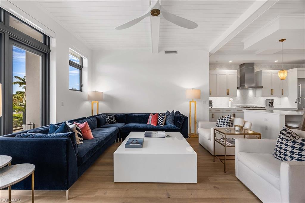875 6th Avenue South, Unit 203 Naples, FL 34102 - Photo 15 of 49 Designer living room showcasing abundant natural light and refined finishes.