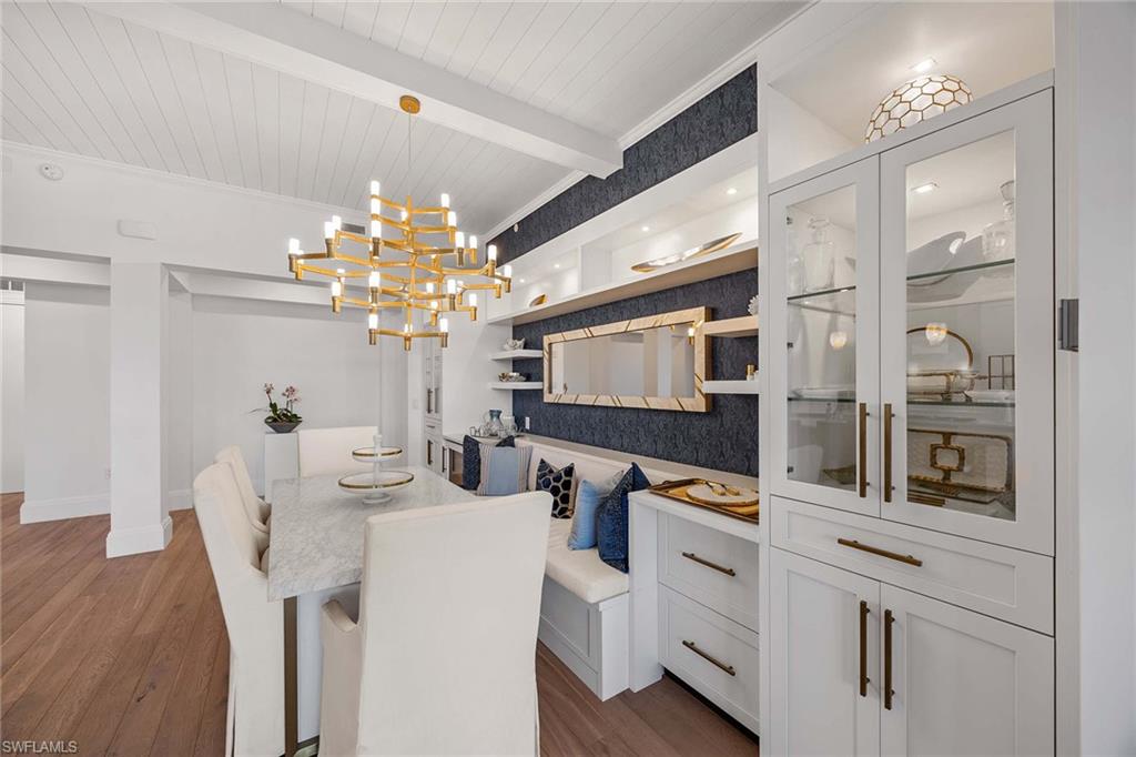 875 6th Avenue South, Unit 203 Naples, FL 34102 - Photo 23 of 49 An elegant dining area designed for connection, open to the kitchen and living room and extending naturally to the lanai.