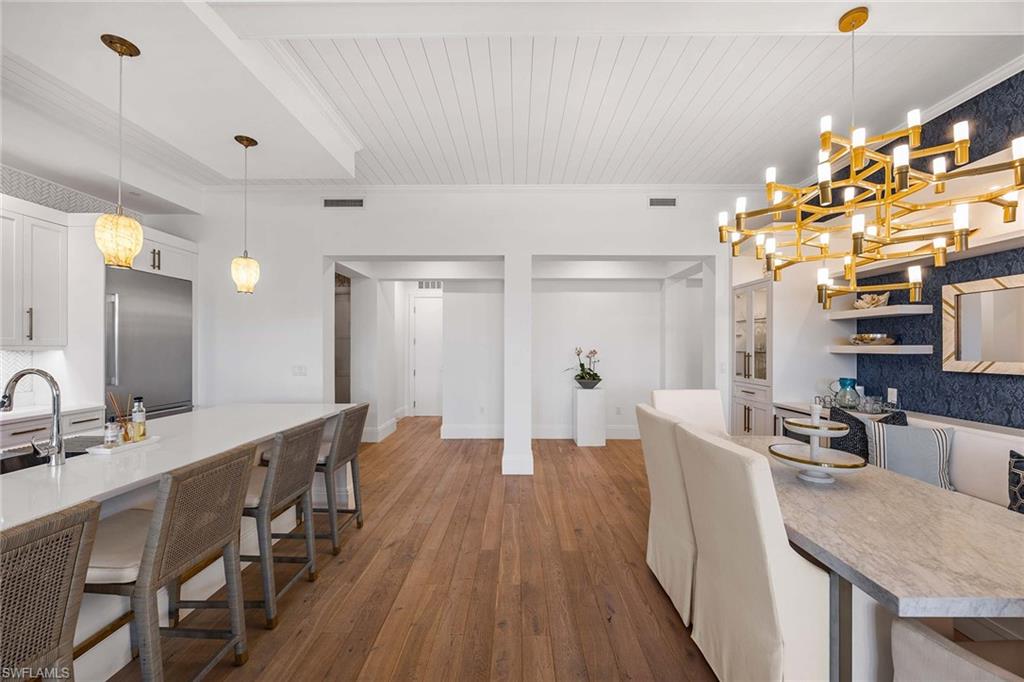 875 6th Avenue South, Unit 203 Naples, FL 34102 - Photo 24 of 49 Thoughtfully designed kitchen offering effortless flow to the living spaces and lanai, perfect for everyday living and hosting.