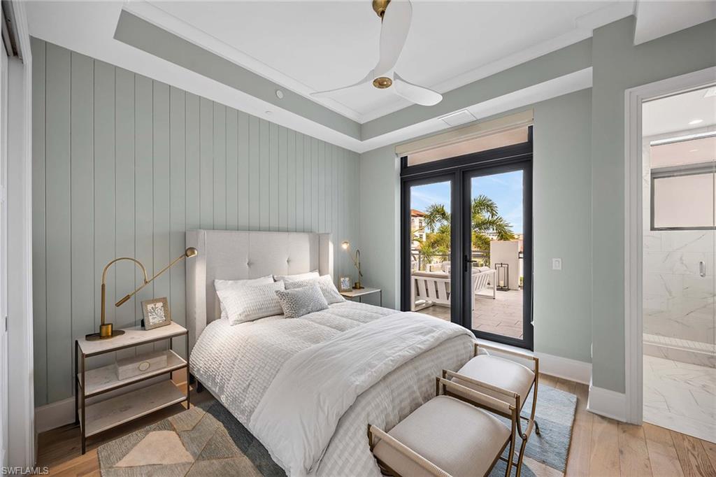 875 6th Avenue South, Unit 203 Naples, FL 34102 - Photo 26 of 49 Additional guest bedroom featuring designer finishes and a bright, welcoming atmosphere.
