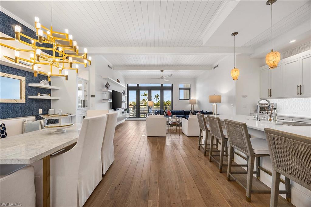 Light-filled living area with seamless indoor-outdoor flow to the expansive lanai.