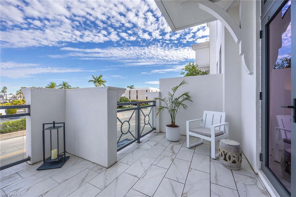 875 6th Avenue South, Unit 203 Naples, FL 34102 - Photo 33 of 49 Secluded lanai corner creating a peaceful outdoor escape adjacent to the guest bedroom.