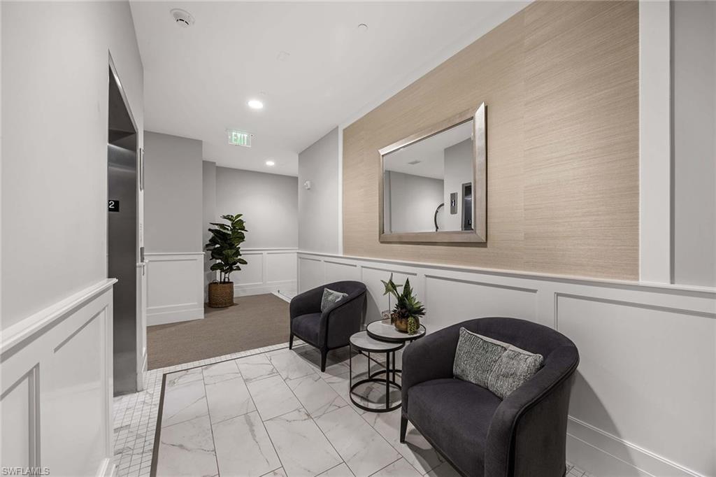 875 6th Avenue South, Unit 203 Naples, FL 34102 - Photo 34 of 49 Private elevator entry creates a refined, residential arrival and sets the tone for the luxury that continues throughout the home.