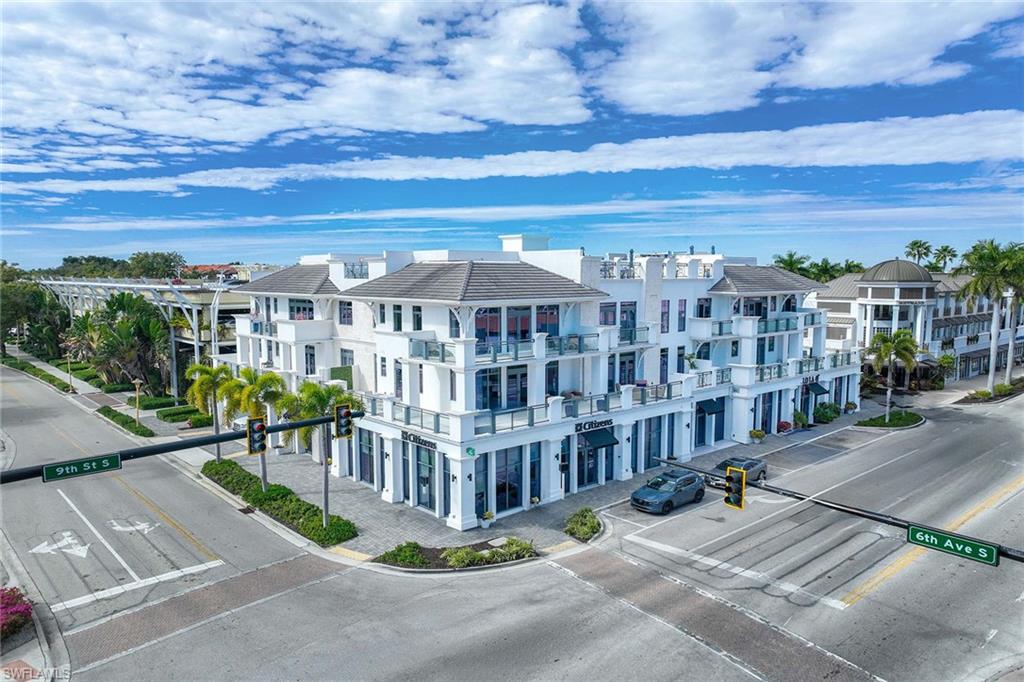 875 6th Avenue South, Unit 203 Naples, FL 34102 - Photo 44 of 49 An elegant first impression—front of the building showcasing timeless design and prime downtown location, highlighting a modern, sophisticated presence.