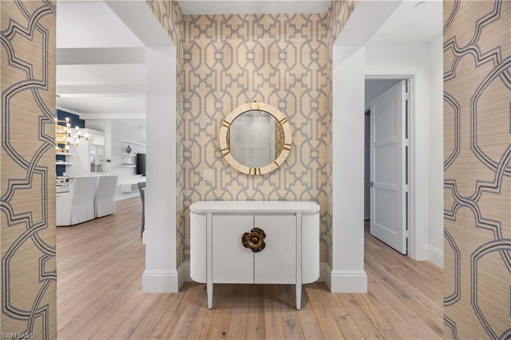 875 6th Avenue South, Unit 203 Naples, FL 34102 - Photo 6 of 49 Beautifully appointed foyer offering a warm and sophisticated first impression.