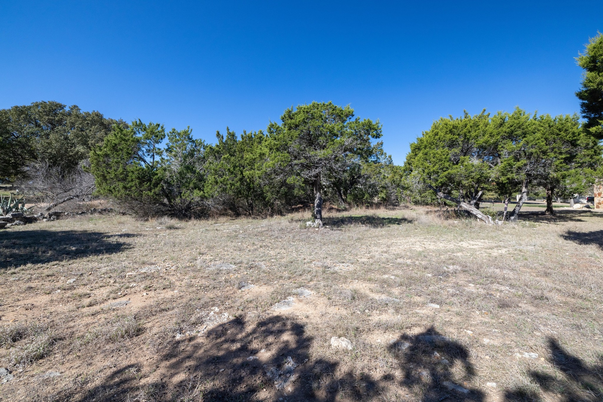 8209 Moon Rise Trail Jonestown, TX 78645 - Photo 3 of 7 a view of outdoor space with deck and yard