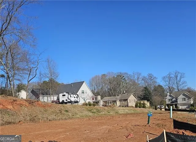 a view of a town with snow on the road