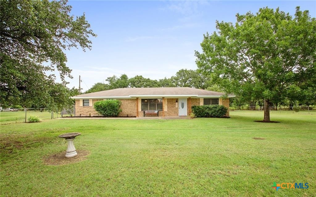 8510 Burgandy Lane Temple, TX 76504 - Photo 1 of 48 a front view of a house with a garden