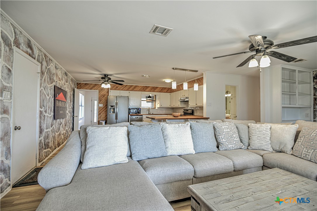 8510 Burgandy Lane Temple, TX 76504 - Photo 11 of 48 a living room with furniture and a chandelier