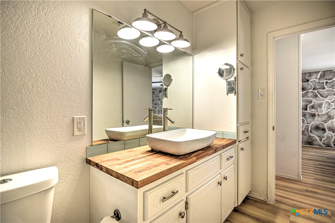 8510 Burgandy Lane Temple, TX 76504 - Photo 15 of 48 a bathroom with a sink a toilet and a mirror